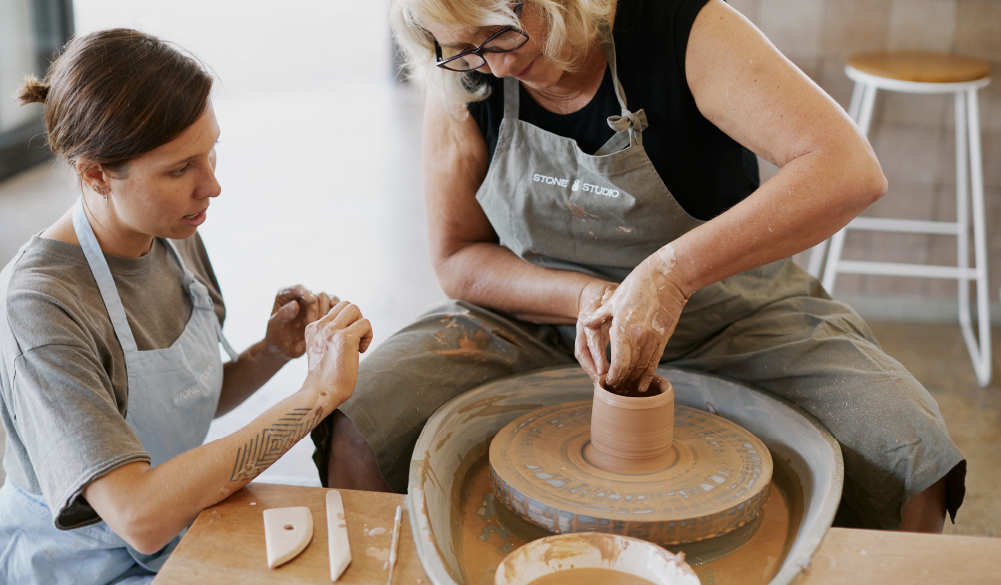 Blanche teaching at the pottery wheel